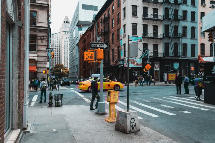 people crossing city street