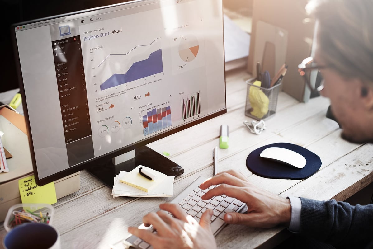 A business man looking at some data analytics 