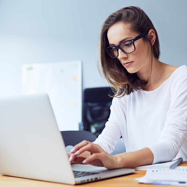 Woman typing on computer