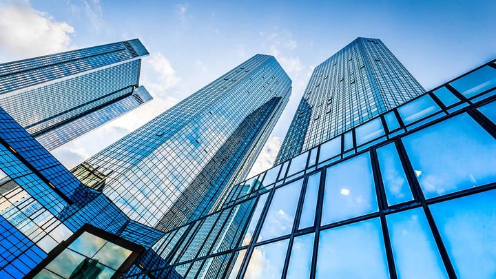 A street view of a few skyscrapers