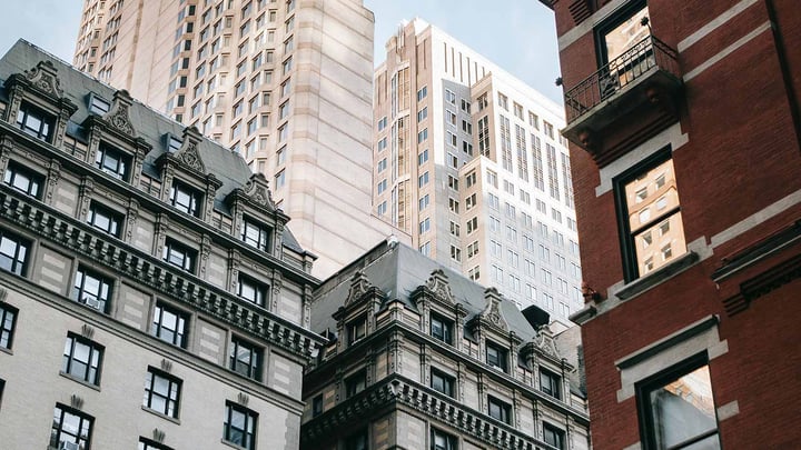 A mid level view of a three high rise buildings