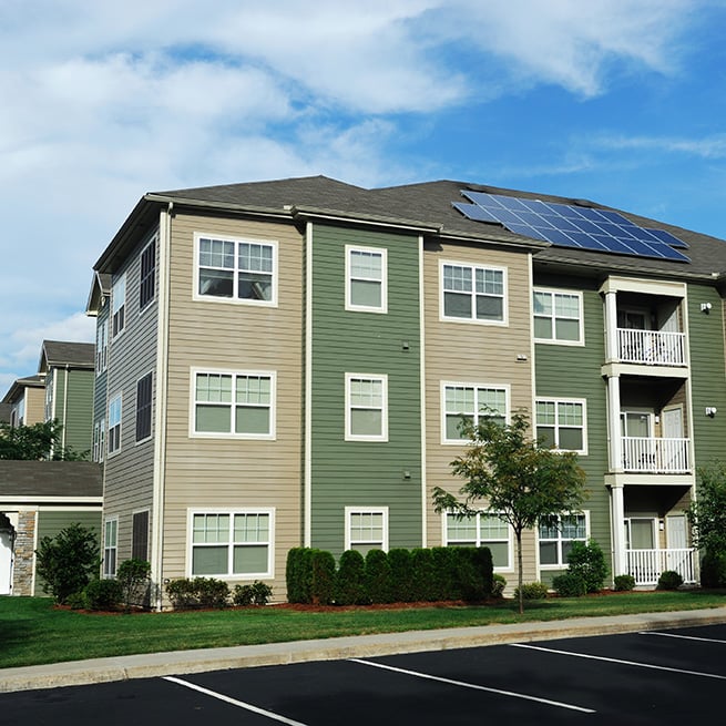 green and tan apartment building